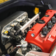 A highly modified Honda K24 engine in a Ferrari engine bay.